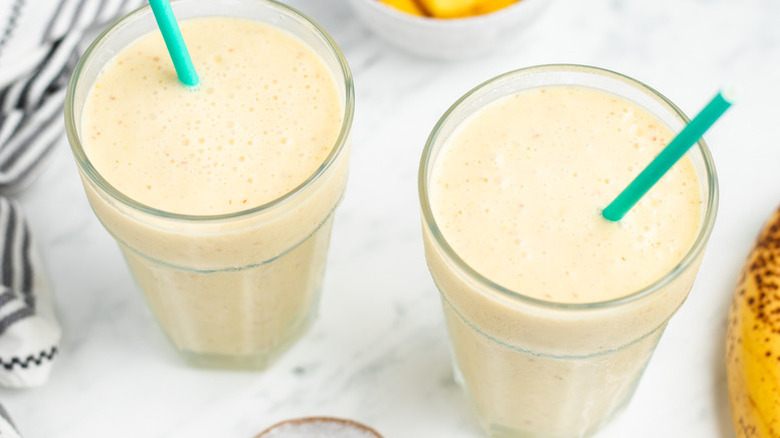 Smoothies in glasses with straws