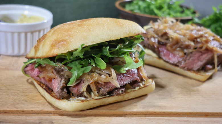 Sirloin steak sandwich on wooden board