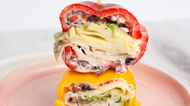 Turkey bell pepper sandwiches stacked on plate