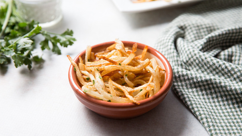 Crispy shoestring fries in bowl