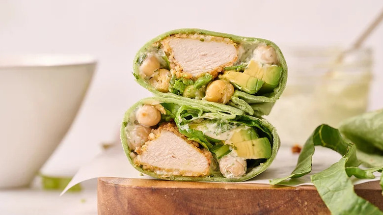 Green Goddess Air-Fried Chicken Wrap stacked on wooden cutting board