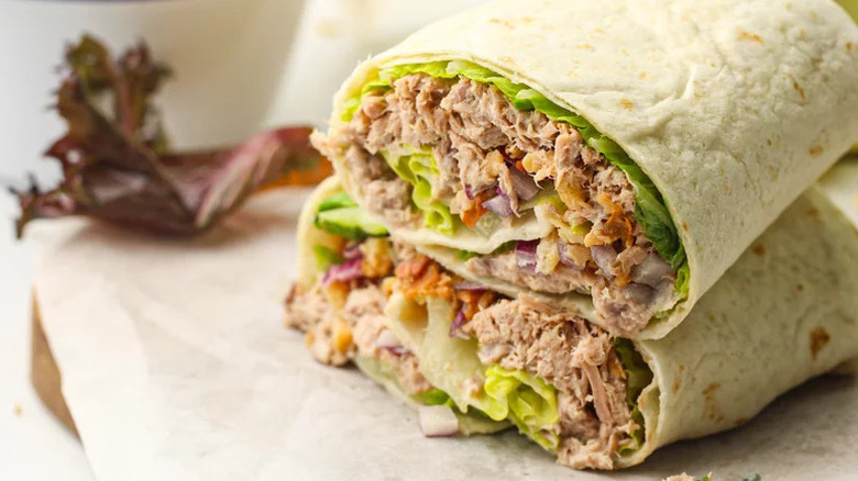 Healthy Tuna Wrap stacked on piece of parchment paper