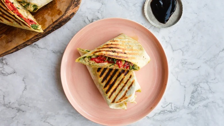 Antipasti Italian Chicken Wrap on pink plate