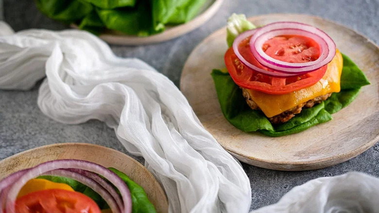 Turkey Burger Lettuce Wraps on wooden plates