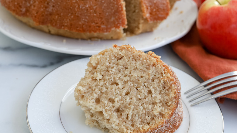 Slice of apple cider bundt cake on plate