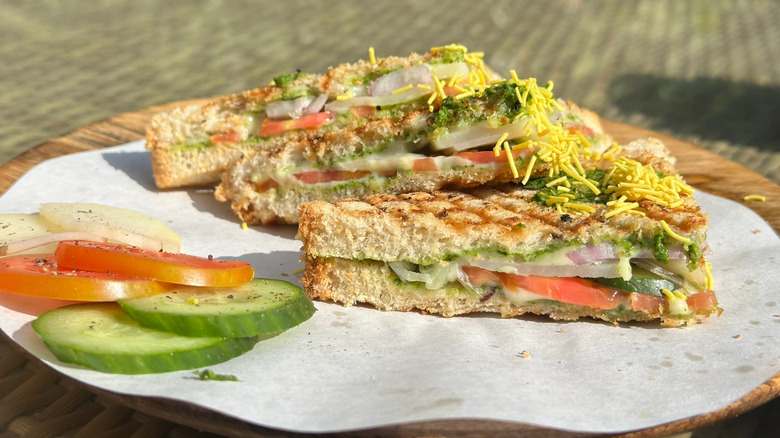 Grilled Bombay sandwich with tomato, cucumbers, and onion