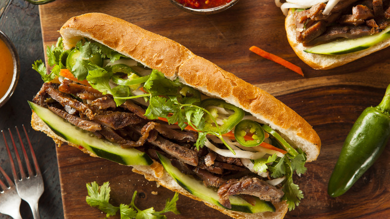 Pork banh mi with jalapeno on cutting board