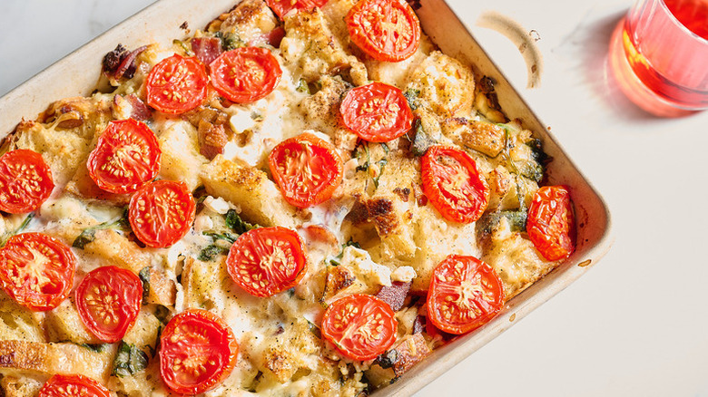 Cheesy tomato breakfast strata in baking dish