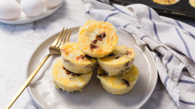 Pile of bacon and egg bites on plate