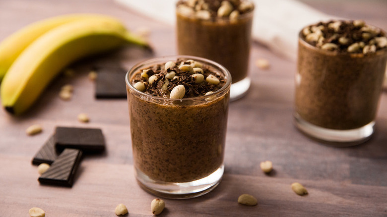 Chocolate and peanut chia pudding in serving glasses