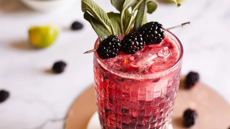 Blackberry Sage Vodka Smash in tumbler with blackberry and sage garnishes