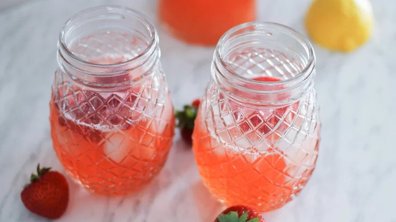 Homemade Strawberry Lemonades in glass jars