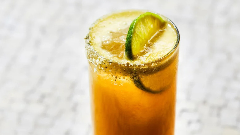 Peach-Tomatillo Michelada in Tom Collins glass