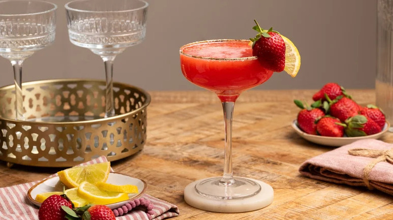 Strawberry Lemon Drop Cocktail in coupe glass on coaster