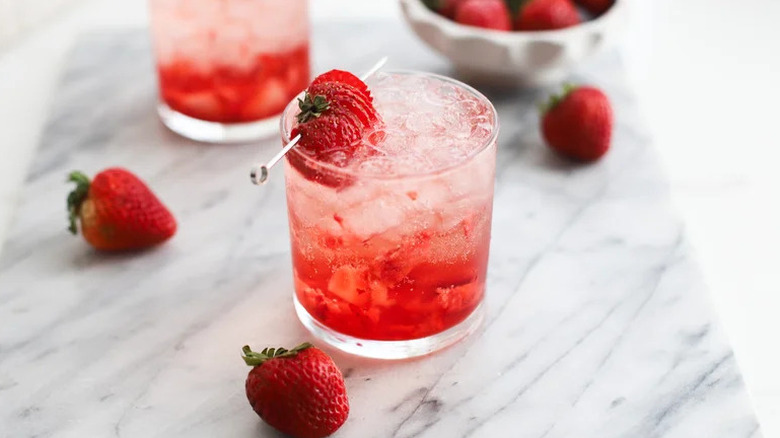 Strawberry Rosé Spritzer in small glass with strawberry garnish