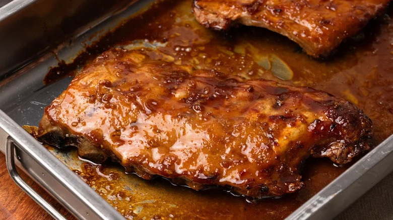 Juicy Baby Back Ribs with Honey Bourbon Glaze in baking pan