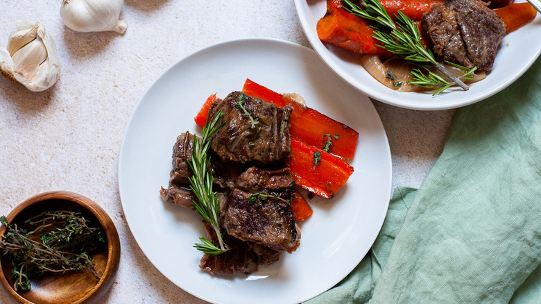 Short Ribs on white plate with carrots