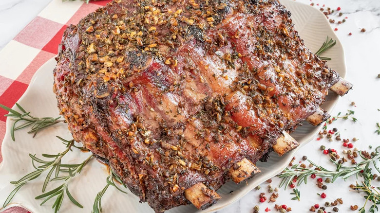 Standing Rib Roast on plate with rosemary