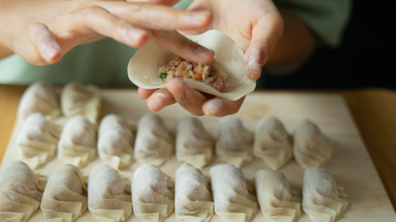 making dumplings by hand 