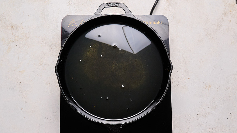 cast iron skillet filled with oil