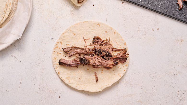 beef arranged in a tortilla
