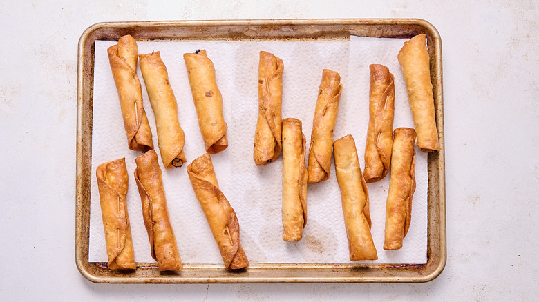 draining flautas on paper towels