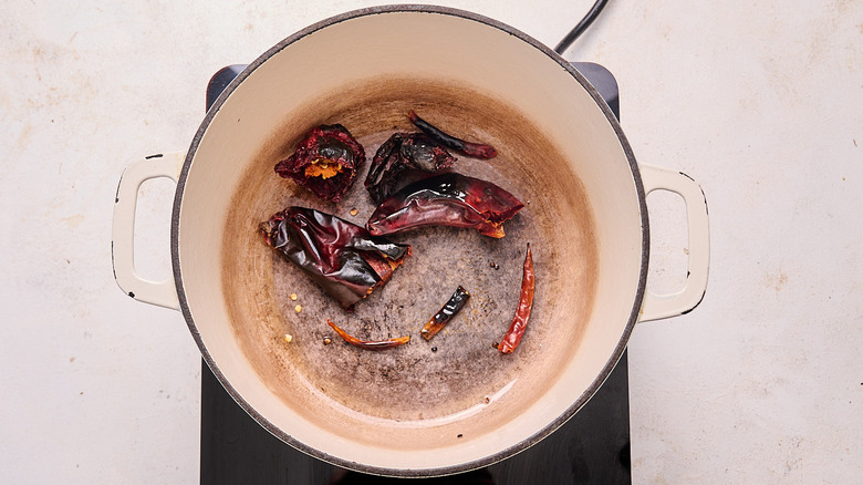 toasting chiles in a pot