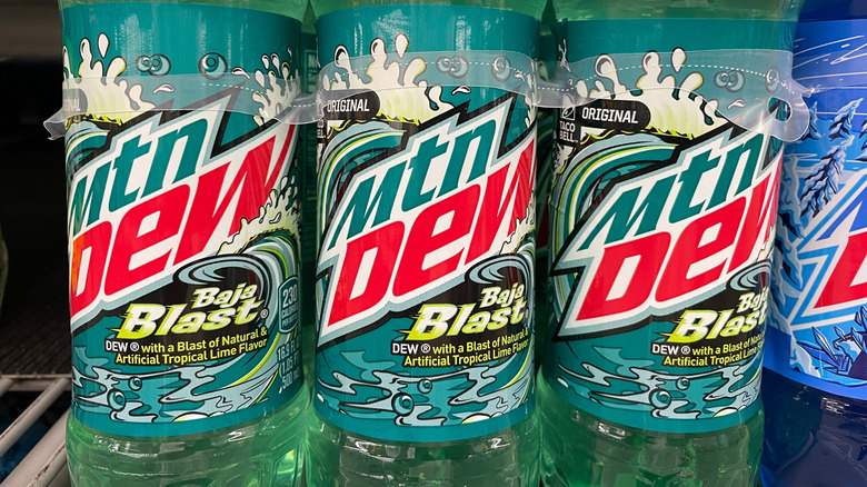 Two-liter bottles of Mtn Dew Baja Blast in a grocery store
