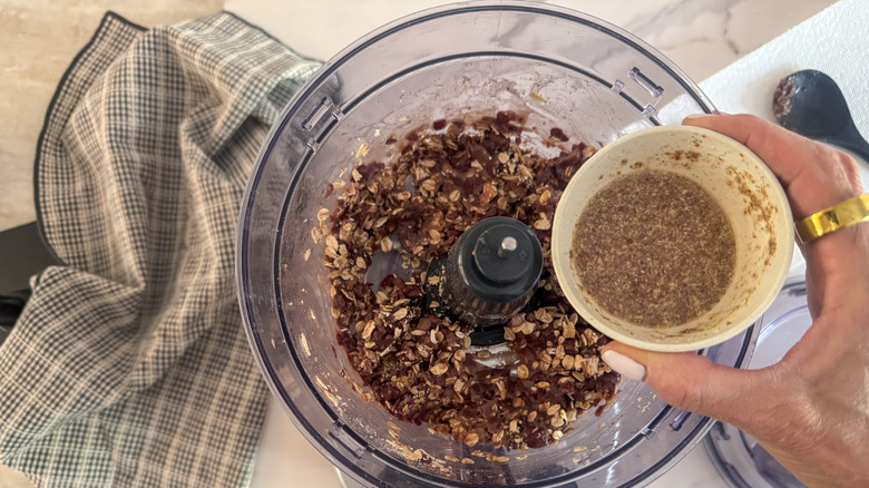 hand adding flax egg
