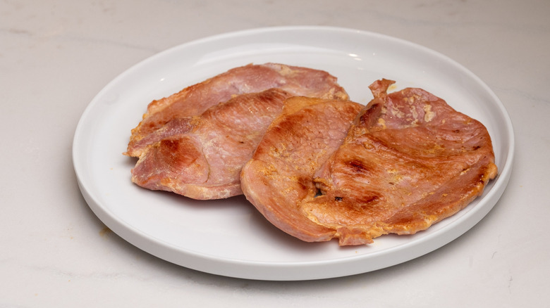 cooked ham steaks on plate