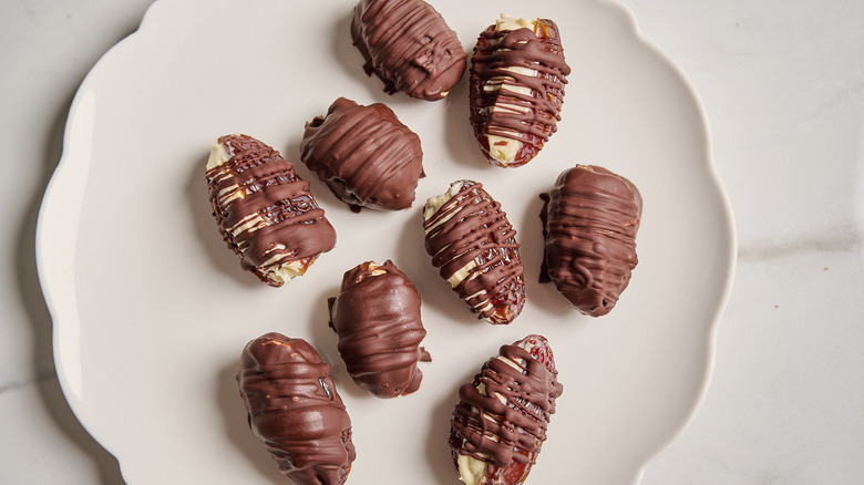 chocolate covered dates on a plate