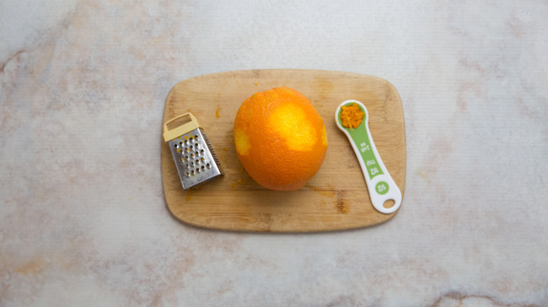 zested orange on board