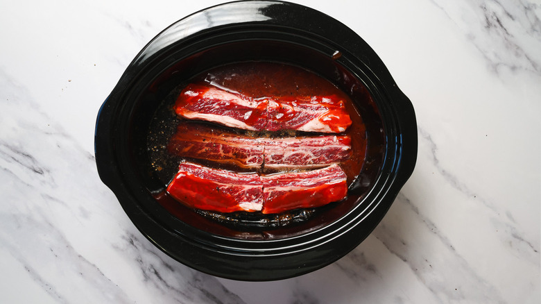 Short ribs with sauce in slow cooker