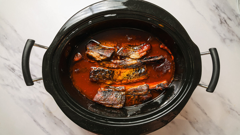 Short ribs with sauce in slow cooker