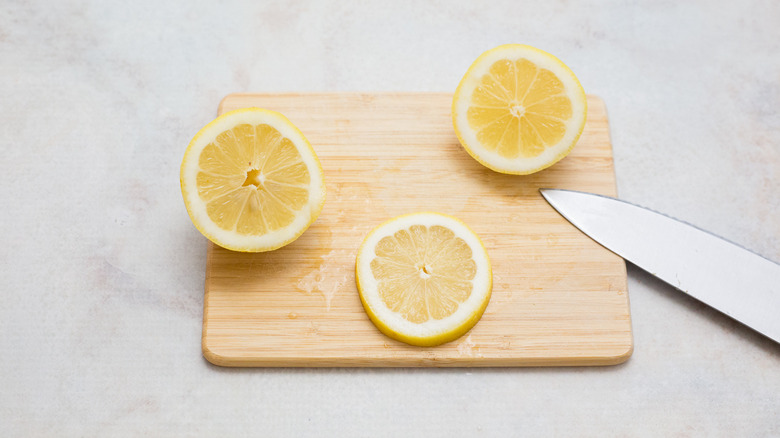 cut lemon on cutting board