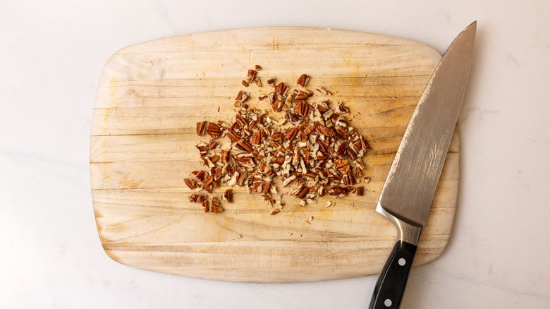 chopped pecans on baking tray