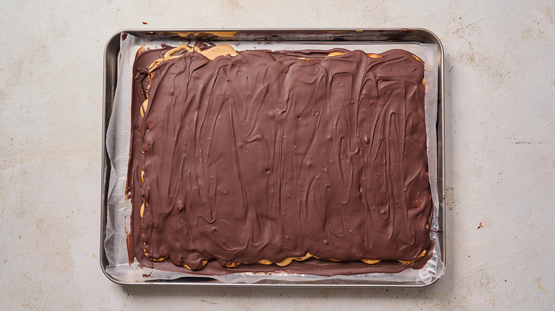 peanut butter pretzel bark on sheet tray