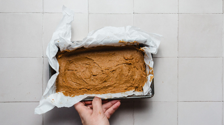 Raw pumpkin bread batter in pan