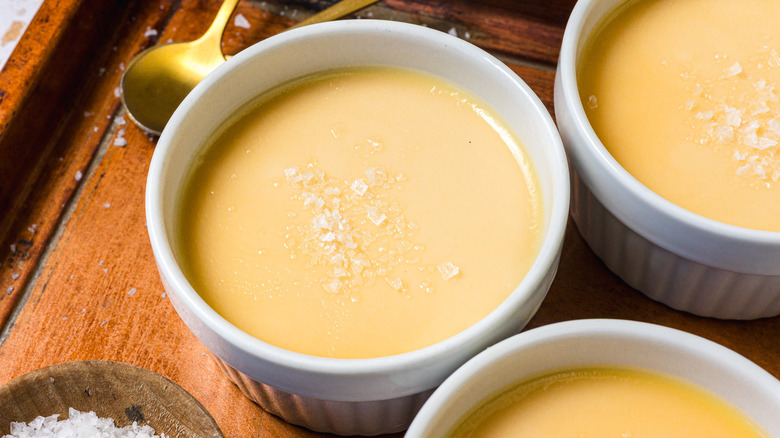 Close up on ramekins of salted caramel panna cotta