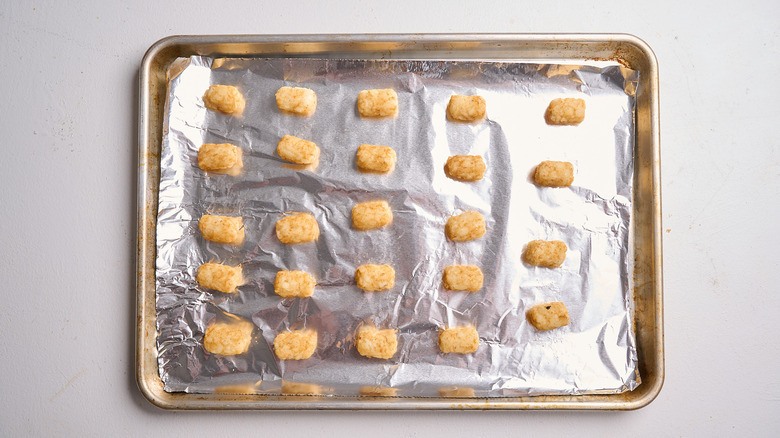 baked tater tots on a sheet tray