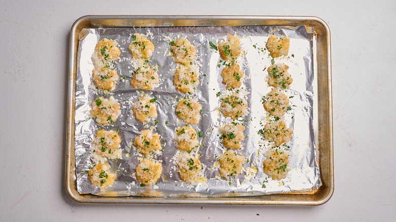 drizzling tater tots with oil and parmesan