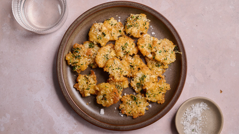 smashed tater tots on a plate