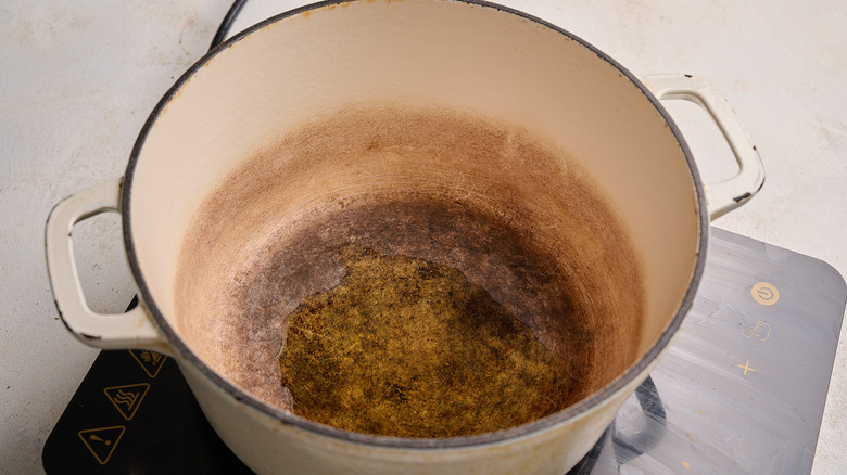 heating olive oil in a pot
