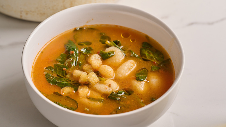 soup in a bowl with gnocchi on top
