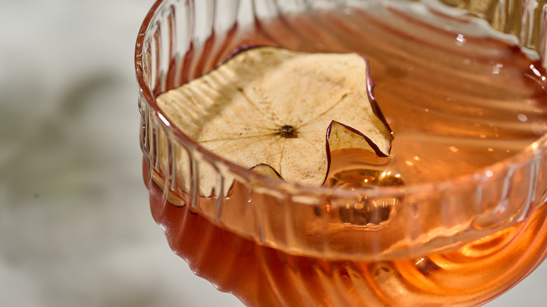 apple garnish in a cocktail