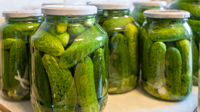Jars of bright green pickles