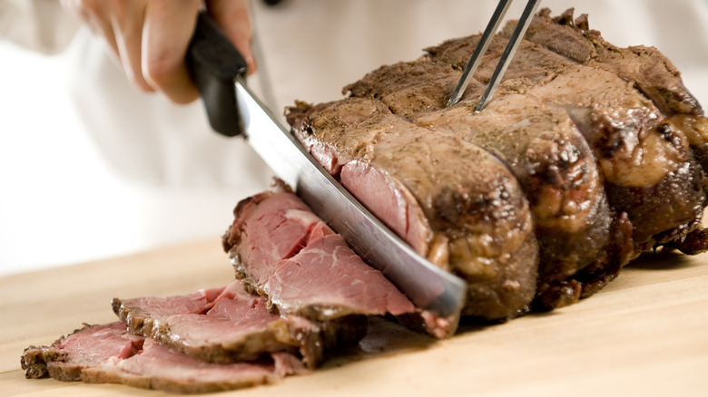 chef slicing roast beef