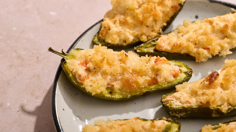 Crab-stuffed jalapeño poppers on plate