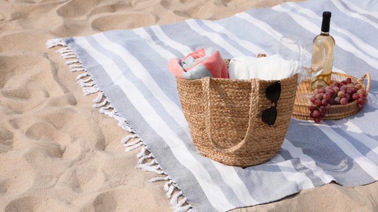 Blanket and bag on beach