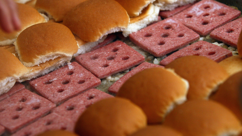 Square slider patties and buns on a flat top